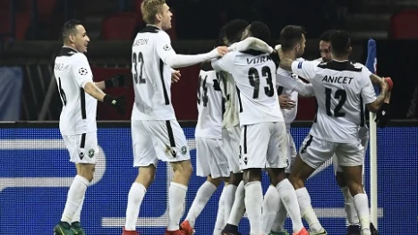 Ludogorets' players celebrate after scoring a goal during the UEFA Champions League Group A football match between Paris Saint-Germain and PCF Ludogorets Razgrad at the Parc des Princes Stadium in Paris on December 6, 2016. / AFP PHOTO / Miguel MEDINA