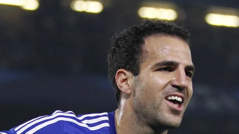 Chelseas Spanish midfielder Cesc Fabregas celebrates scoring the opening goal of the UEFA Champions League, group G football match between Chelsea and Schalke 04 at Stamford Bridge, in London on September 17, 2014. AFP PHOTO / IAN KINGTON